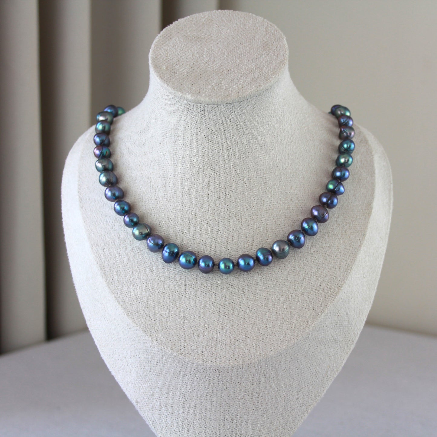 Parelketting pauwenkleur