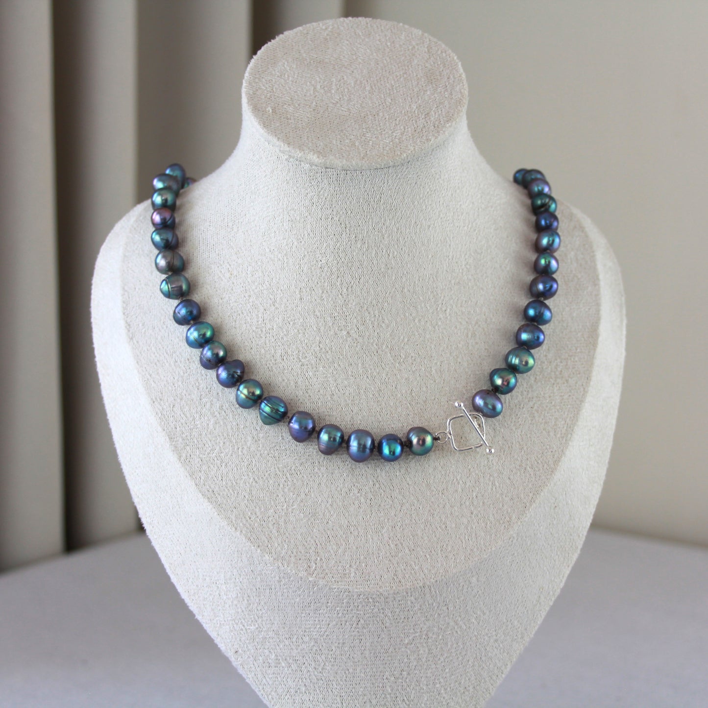 Parelketting pauwenkleur