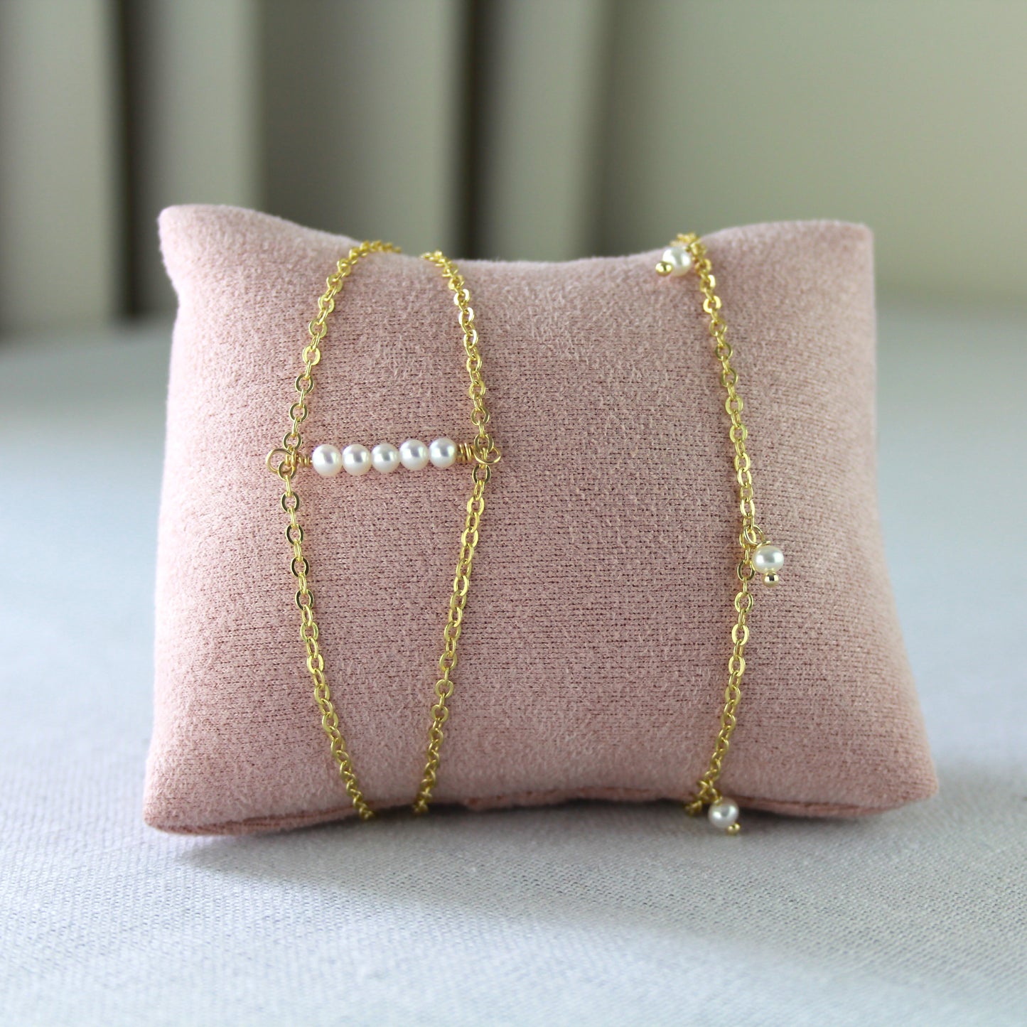 Dubbele gouden schakelketting met parels