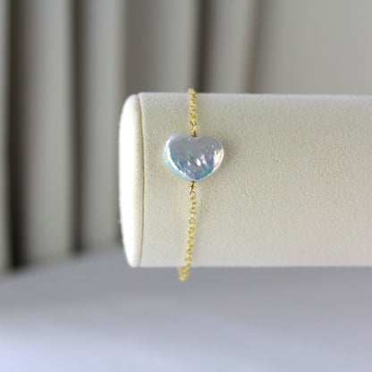 Hartparel met gouden ketting armband