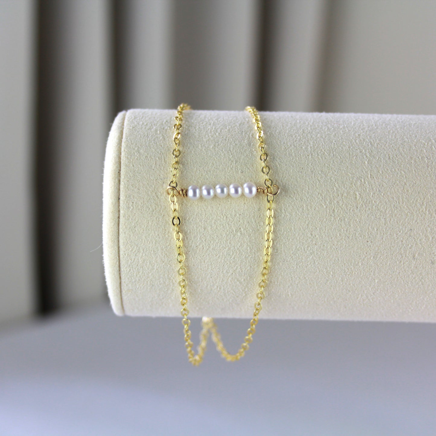 Dubbele gouden schakelketting met parels