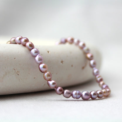 Paars parelketting met gouden slot