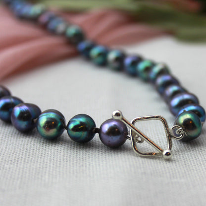 Parelketting pauwenkleur