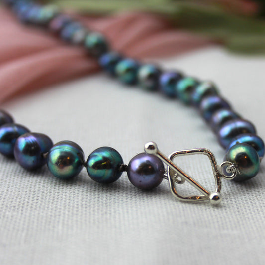 Parelketting pauwenkleur