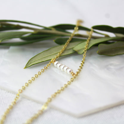Dubbele gouden schakelketting met parels