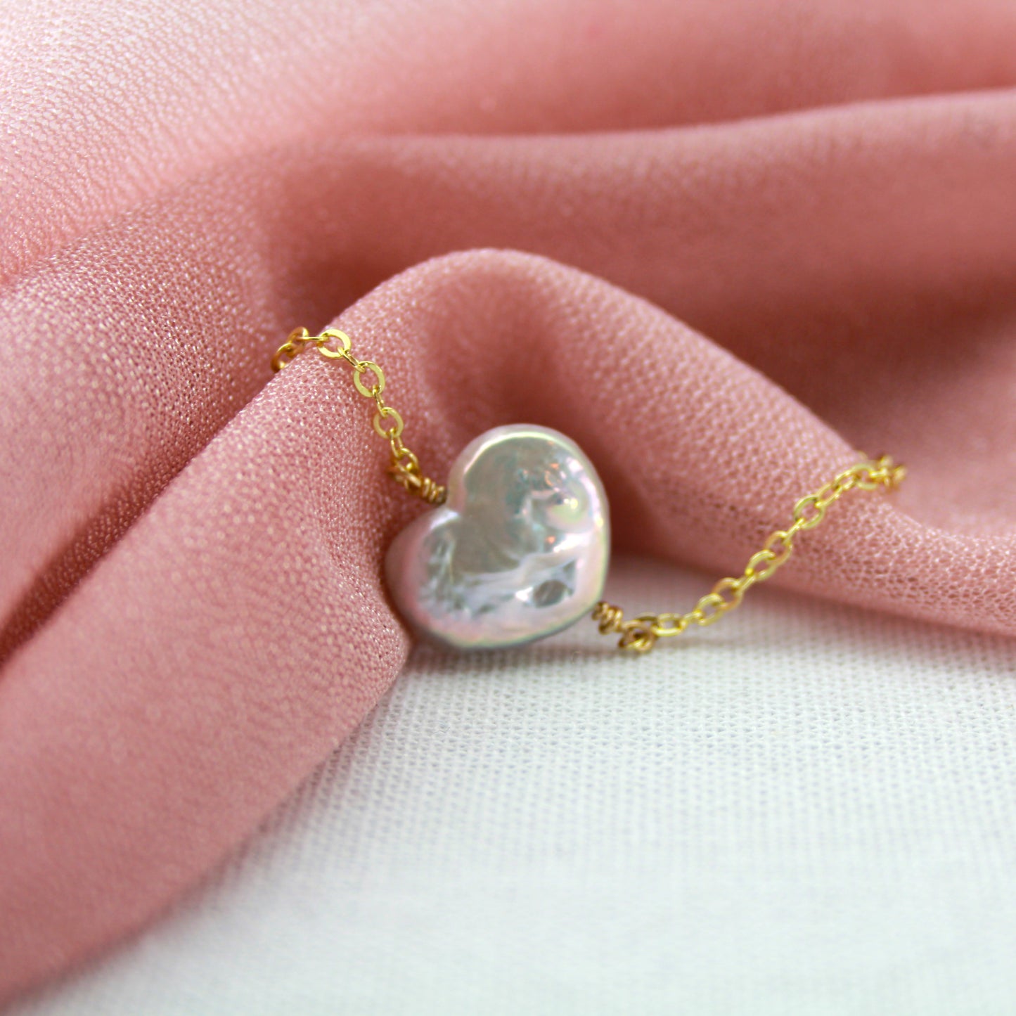Hartparel met gouden ketting armband